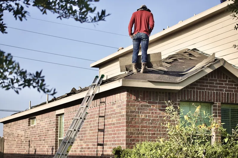 Professional roofer working on a residential roof in Galena Park